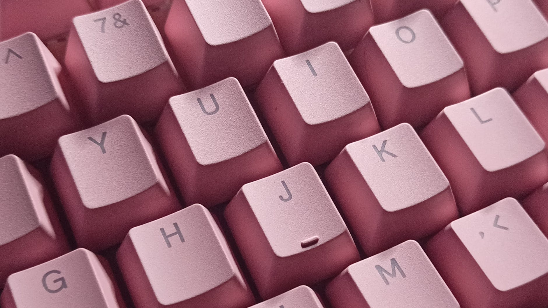 close up shot of pink computer keyboard